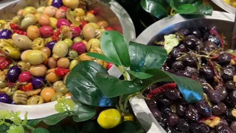 Olive varieties. Plates with different types of olives and olives on the mark Stock Footage 237432489