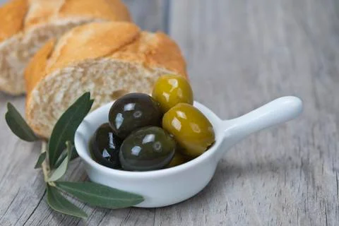 Olives and bread Stock Photos