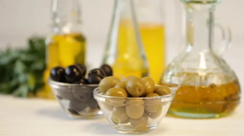 Olives and Pouring Olive Oil. Extra virgin olive oil pouring from the bottle. Stock Footage 59702140