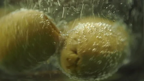 Olives in a drink, bobbing with bubbles Stock Footage 94693931