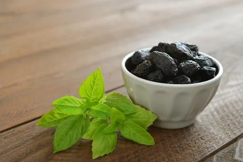 Olives with fresh basil Stock Photos