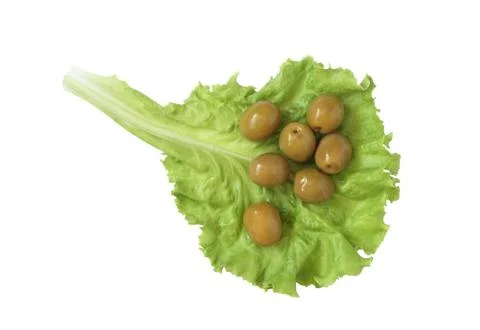 Olives on lettuce Stock Photos