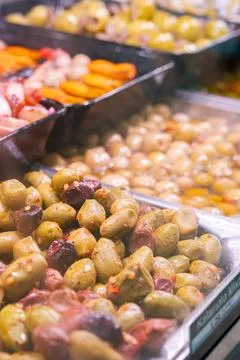 Olives marinated in different ways 스톡 사진