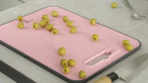 Olives spill onto the board Stock Footage 269119989