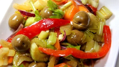 Olives on vegetable salad with rotating frame Stock Footage 85395783