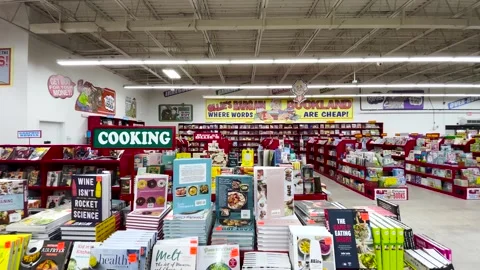 Ollies retail store interior pan of book area at front Stock Footage 174874890