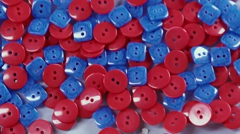 Olored buttons made of plastic. Accessories for clothes. Red and blue 스톡 동영상 68951257