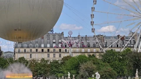 Olympic Cauldron And Ferris Wheel In Paris Stock-Footage 343047568