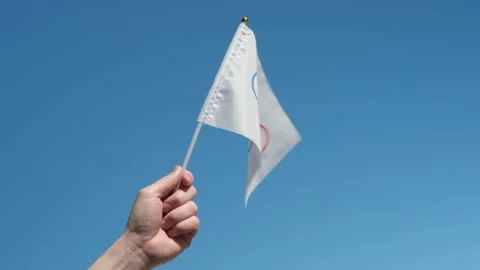 The Olympic flag, small in hand Stock Footage 152169483