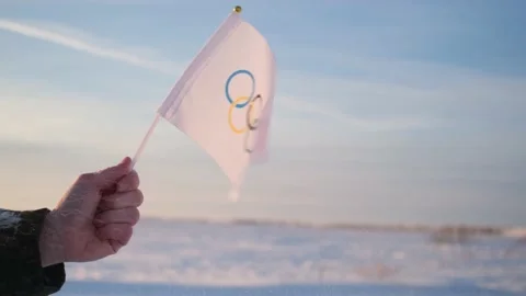 The Olympic flag, small in hand Stock Footage 167512726