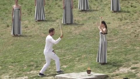 Olympic flame for Paris 2024 Summer Games lit in Ancient Olympia in Greece Stock Footage 276727467