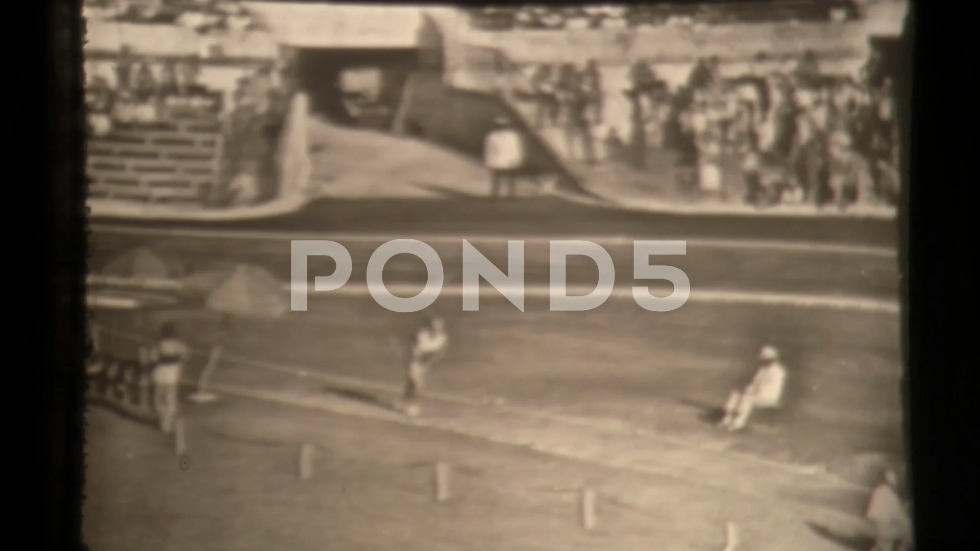 Track athlete landing in sand on long jump in super slow motion