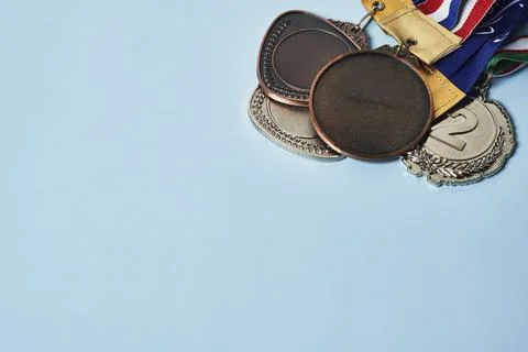 Olympic medals on bright background Stock Photos