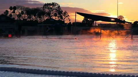 Olympic Pool at Sunset with Mist Stock Footage 11297049