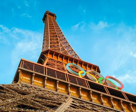 Olympic rings mounted on Eiffel tower for Paris 2024 Stock Photos