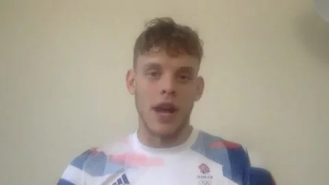 Olympic star urges students to test regularly as schools return Video stock 159597030