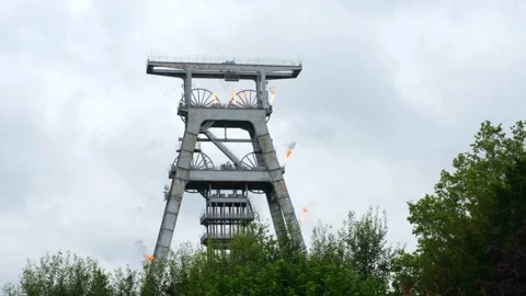 The Olympic torchbearer sets fire to a mine trestle in Wallers Arenberg. Stock Footage 278475512