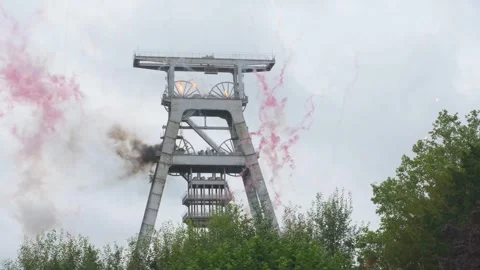 The Olympic torchbearer sets fire to a mine trestle in Wallers Arenberg. Stock Footage 278475523