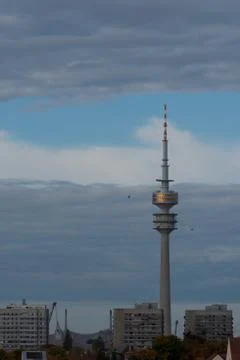Olympic tower in Munich before cloudy sky Stock Photos