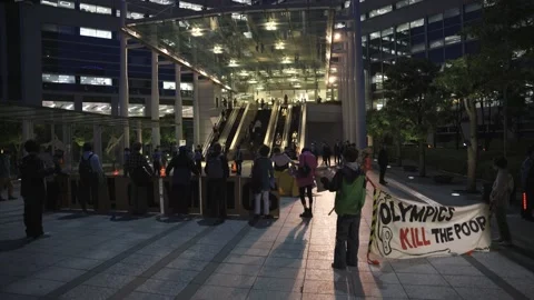 "Olympics Kill the Poor" - Night protest against the Tokyo Olympics - 4K Stock Footage 154898906