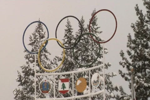 OlympicTorch&amp;Towers NTSC DV Stock Footage 841875