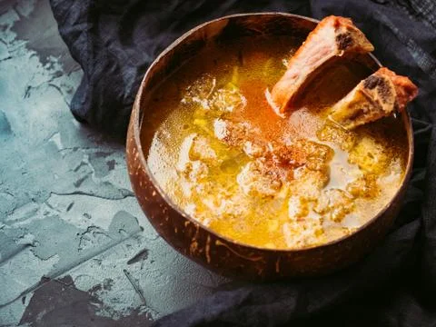 OLYMPUS DIGITAL CAMERA Plate of fragrant, vegetable soup with smoked ribs and Stock Photos