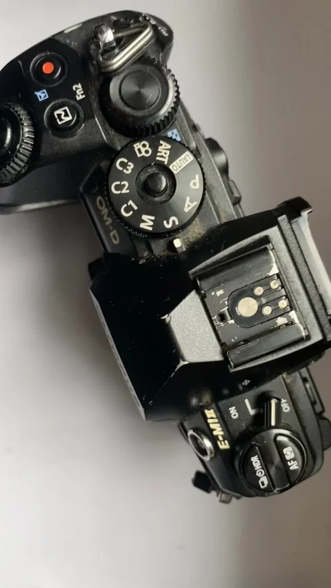 Olympus OM-D E-M1 mark II mirrorless camera showing its controls Stock Footage 303055312