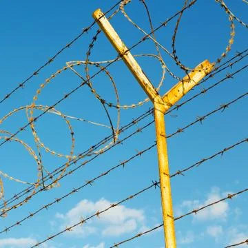 In oman barbwire in the background and cloudy sky Stock Photos