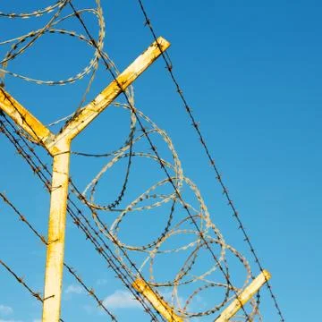 In oman barbwire in the background and cloudy sky Stock Photos