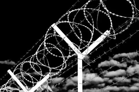 In oman barbwire in the background and cloudy sky Stock Photos
