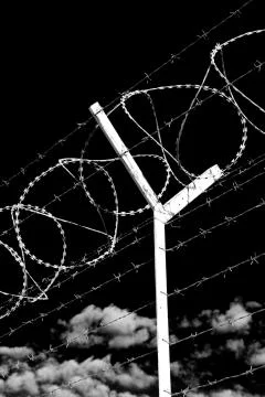 In oman barbwire in the background and cloudy sky Stock Photos