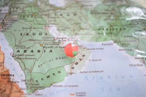 Oman flag drawing pin on the map Stock Photos