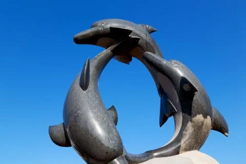 In  oman   old statue of dolphin Stock Photos
