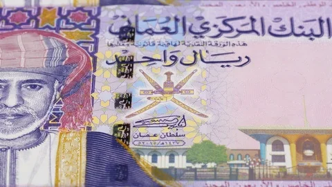 Oman one rial notes tracking. Slider shot. Low angle, macro. 4K Stock Footage 125909301