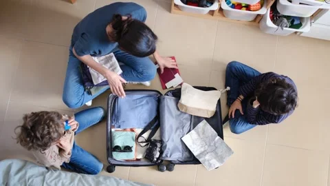 Oman preparing suitcase with 2 sons trip Vídeos de archivo 270484695