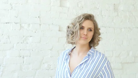 Oman standing into studio room posing for photos and smiling Stockbeeldmateriaal 88959729