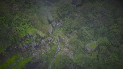 Oman, a waterfall in the park of the Sultanate of Oman Stock Footage 106779987