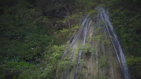 Oman, a waterfall in the park of the Sultanate of Oman Stock Footage 106780764