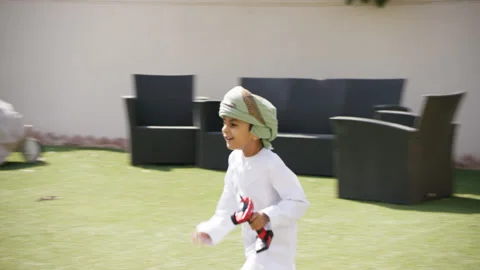 Omani boy playing in the garden. Stock Footage 151281442