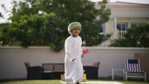 Omani boy running with flags. Stock Footage 151370619