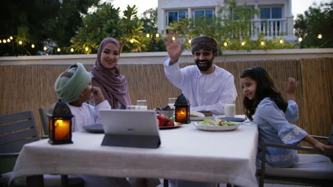 Omani family video calling while eating. Stock Footage 152921771