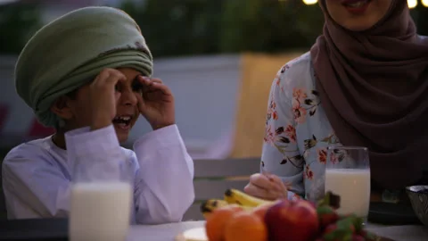 Omani family video calling while eating. Stock Footage 152932299