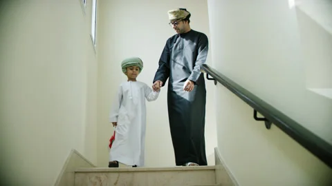Omani father and son with flags. Stock Footage 152748580