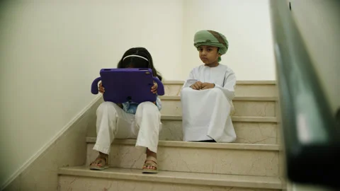 Omani kids playing with the tablet. Stock Footage 152740409
