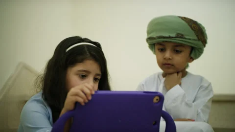 Omani kids playing with the tablet. Stock Footage 152743082