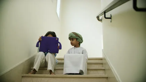Omani kids playing with the tablet. Stock Footage 152743097