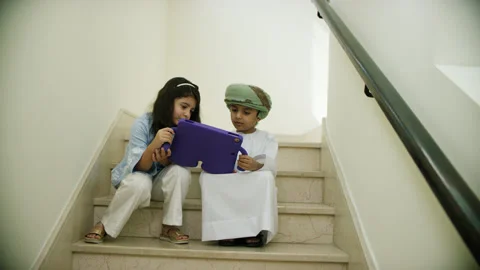 Omani kids playing with the tablet. Stock Footage 152744930