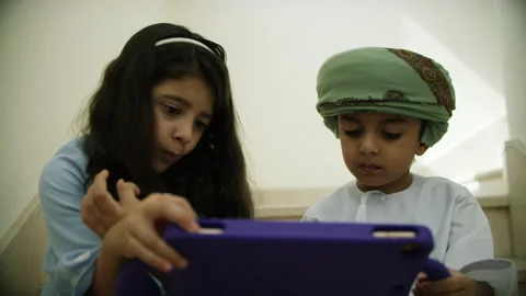 Omani kids playing with the tablet. Stock Footage 152745558