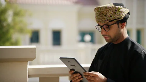 Omani man looking at his tablet. Stock Footage 152719345