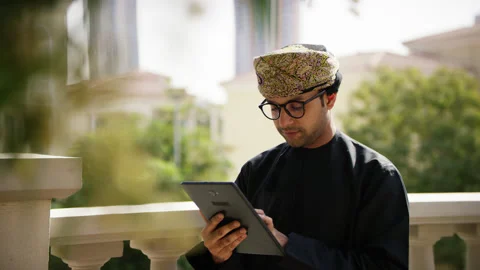 Omani man looking at his tablet. Stock Footage 152721955